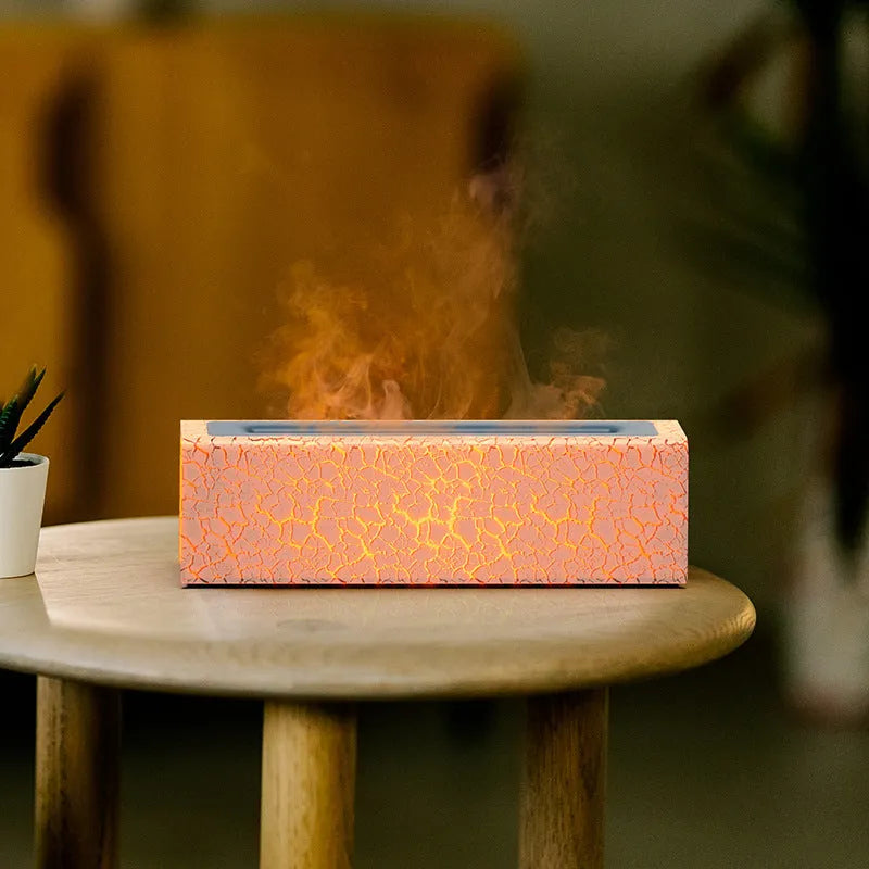 Square creative lava flame atmosphere humidifier and aroma diffuser with colourful LED lights on a desktop.