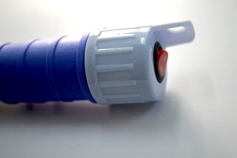 Red and blue manual hand pump siphon for transferring fuel oil and gasoline