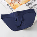 Men's black ice silk seamless briefs with bulge gun egg design on a mid-waist model