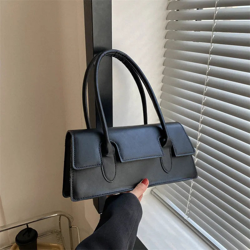 Women's black PU leather square shoulder bag with single strap and stitching details