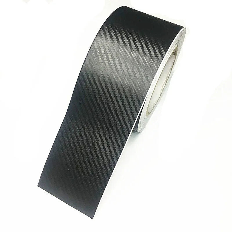Matte carbon fibre car door sill protector roll showing 3D textured pattern with adhesive backing