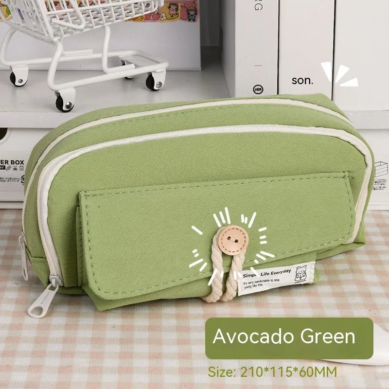 Large capacity Korean-style canvas pencil case for girls in green, holding multiple pens.