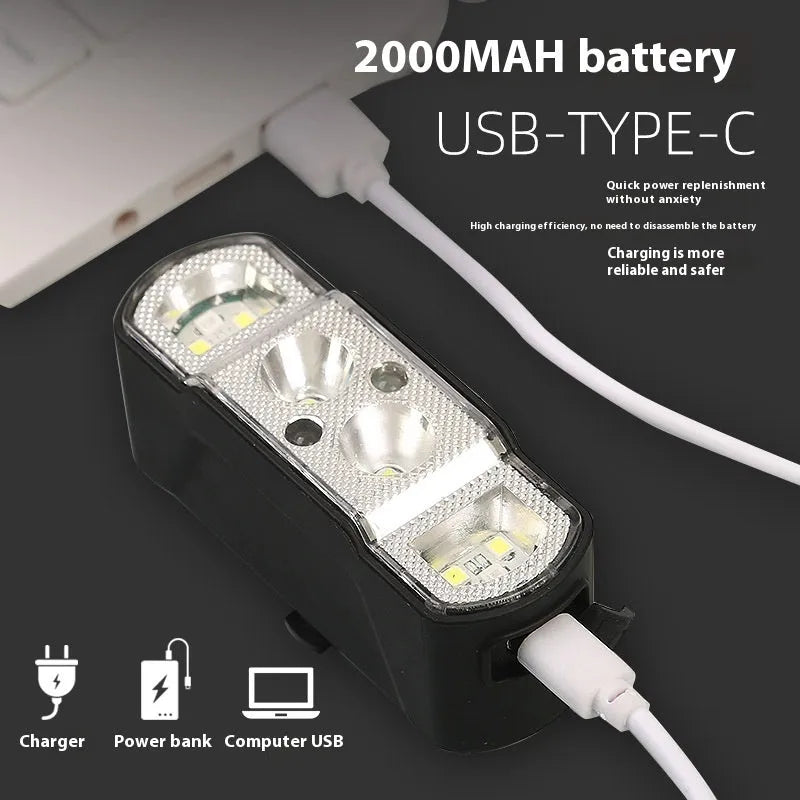 Black bicycle headlight with 350 lumen LED, rechargeable battery, and wave induction controls