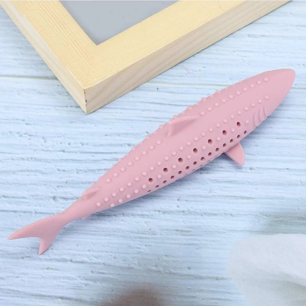 Green fish-shaped silicone chew toy for cats with visible side holes and a removable section for catnip.