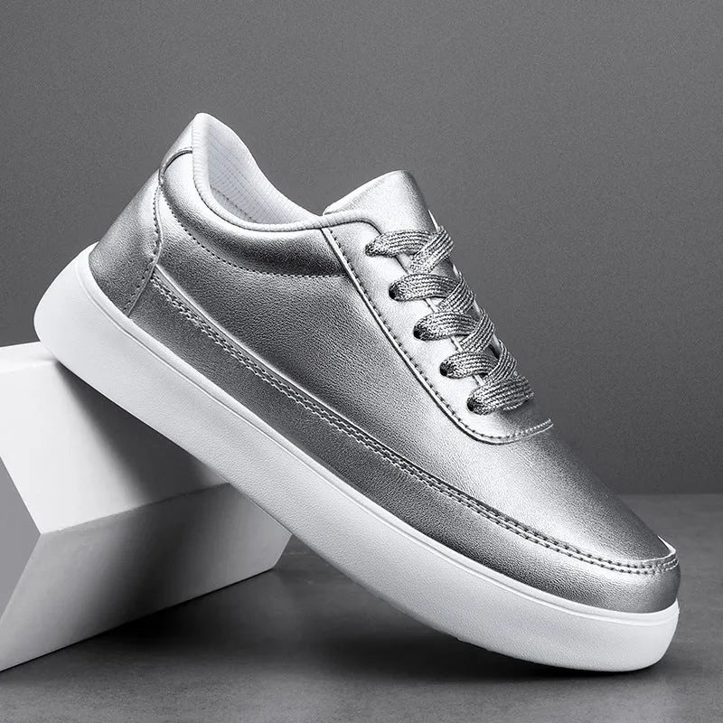 Women's white leather lace-up flat casual shoes on a neutral background.