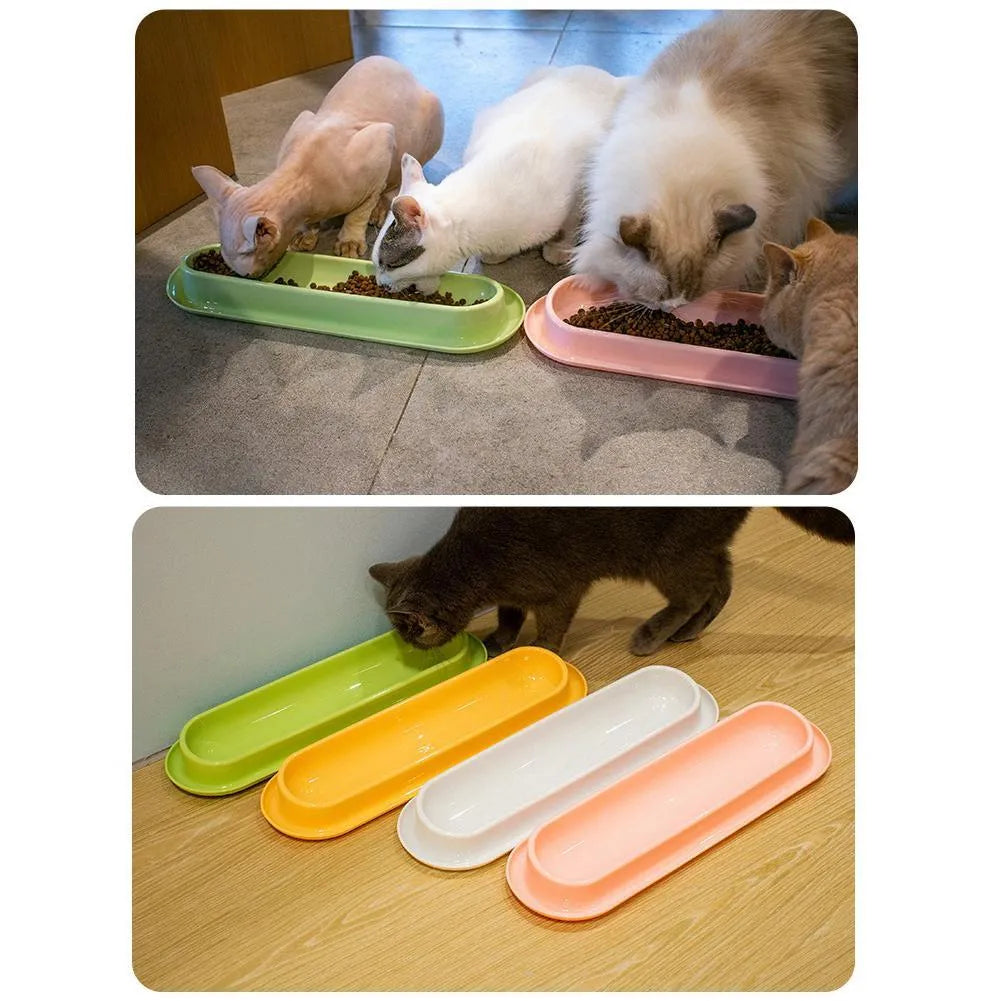 Green 4-piece pet feeder set with two bowls on a non-slip silicone mat