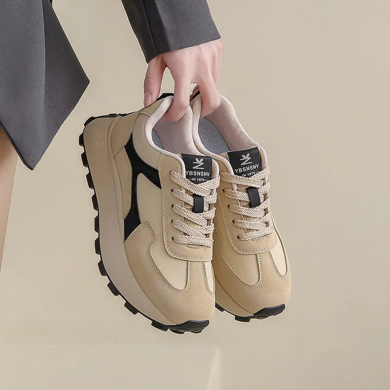 Women's solid colour platform sports running shoes with mesh upper and rubber sole in three colour options.