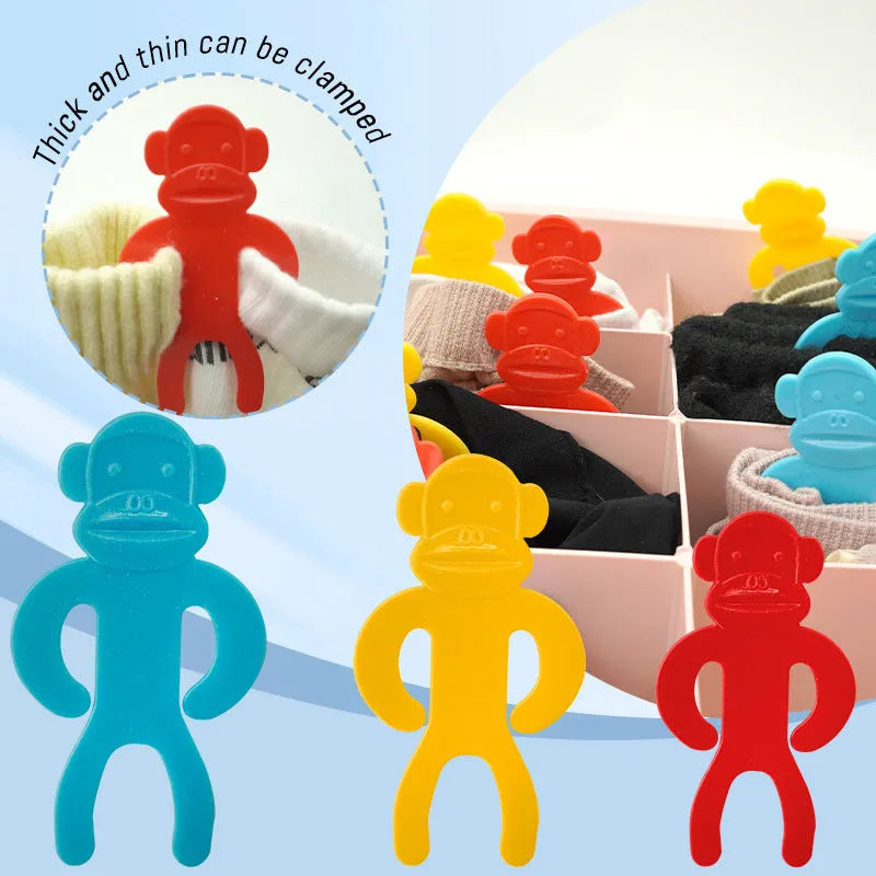 Plastic socks storage clips in blue, yellow, and red colours for keeping pairs together during machine washing