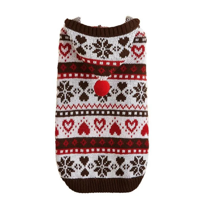 Pink striped camouflage knitted dog sweater with snowflake and heart pattern on a small white dog.