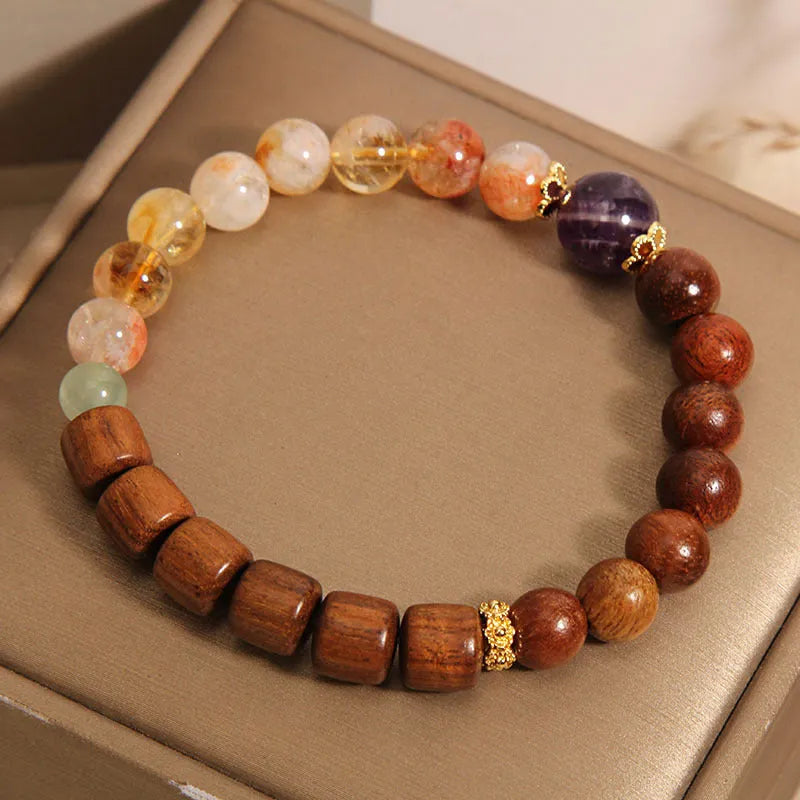 Women's crystal bracelet with yellow tower crystal and ebony amethyst beads featuring pearl and rhinestone accents