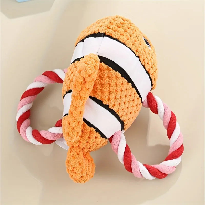 Turtle shaped plush dog toy with knot design and squeaker in grey, green, or orange colours