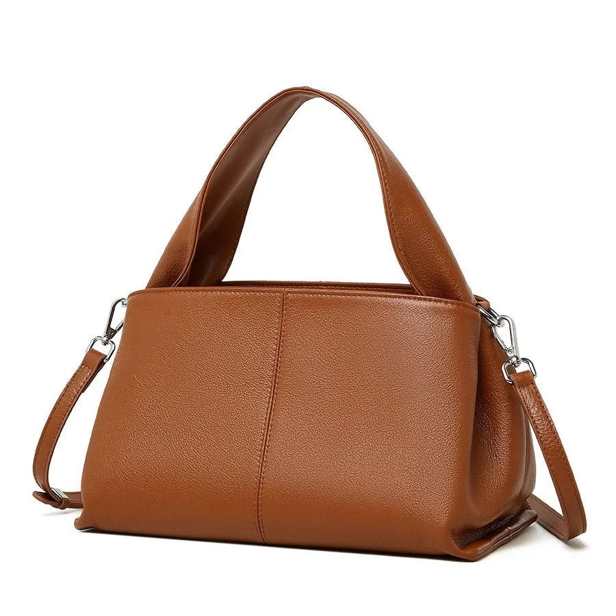 Genuine cowhide messenger bag in horizontal square shape with double shoulder straps and retro texture