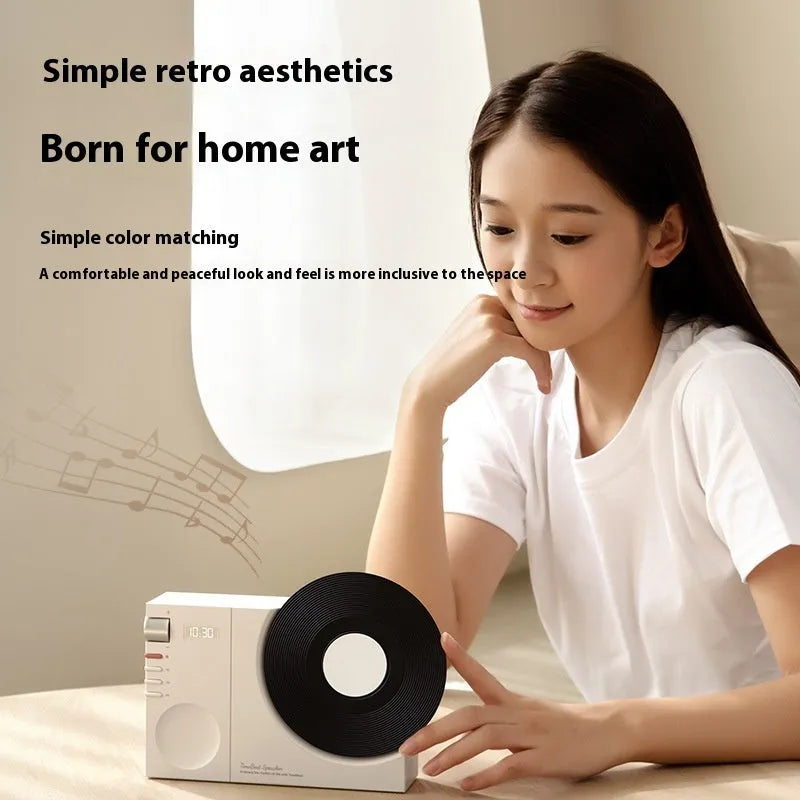 Compact portable Bluetooth speaker in Obsidian Black colour showing card insertion slot and USB charging port.