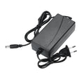 Automobile headlamp repair kit showing stainless steel polishing cup and power adapters for GB/US and European vehicles