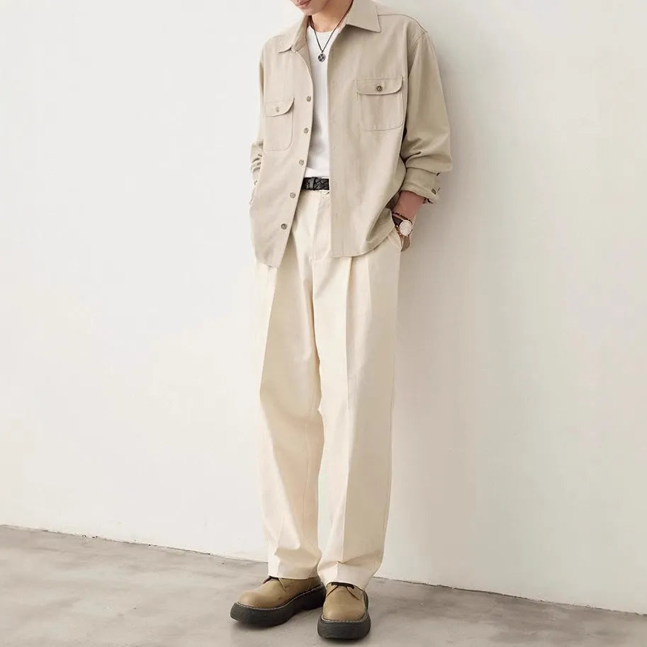 Men's light sand rice coloured lapel collar long sleeve casual shirt on a hanger.