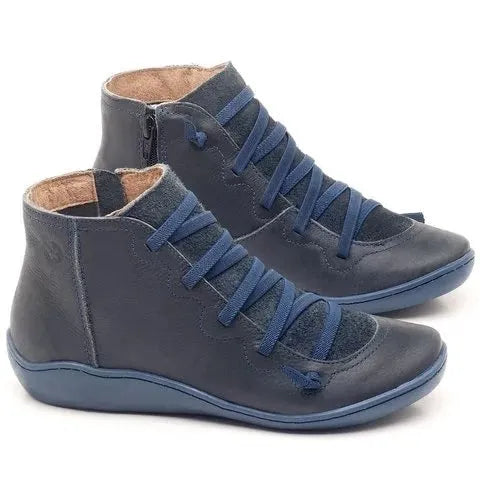 Women's casual flat ankle boots in various colours with a round toe and rubber sole.