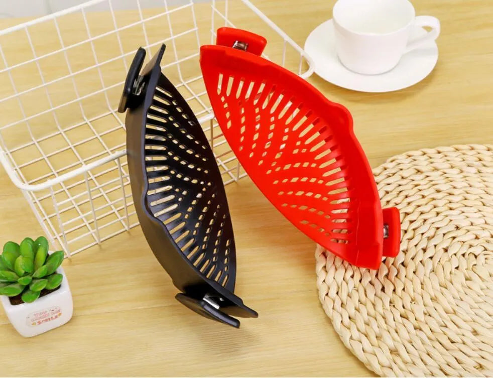 Silicone clip-on funnel colander in kitchen draining liquid from pot