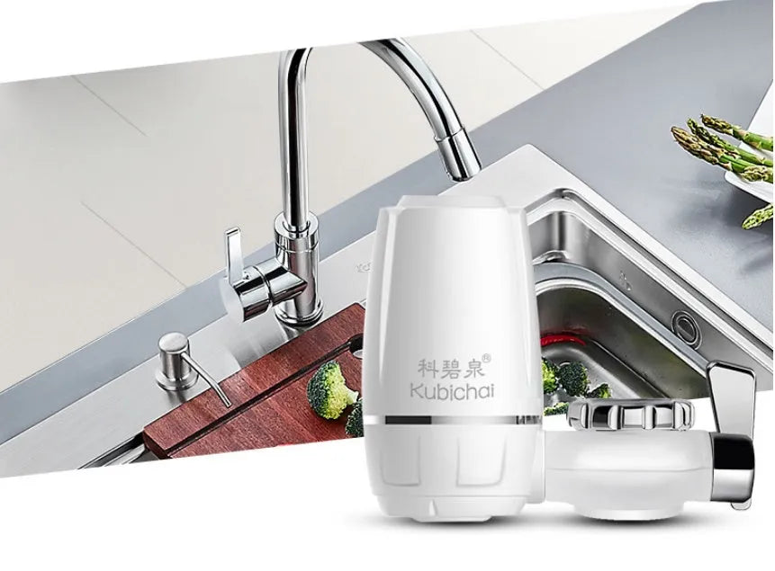 White plastic faucet water filter with adapter kit and ceramic cartridge for kitchen tap installation.