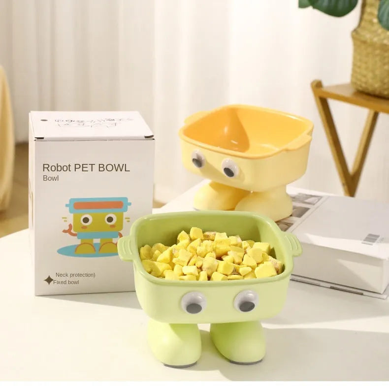 Green elevated cat bowl with cartoon robot design and 15° tilt angle