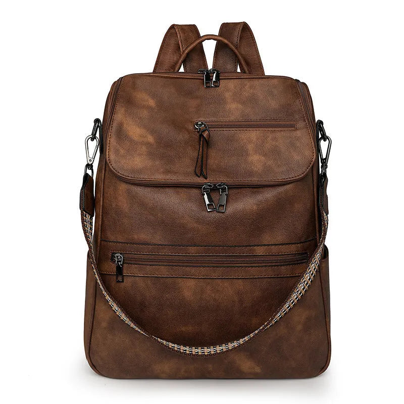 Retro college student backpack in PU leather with curved shoulder straps and solid colour options