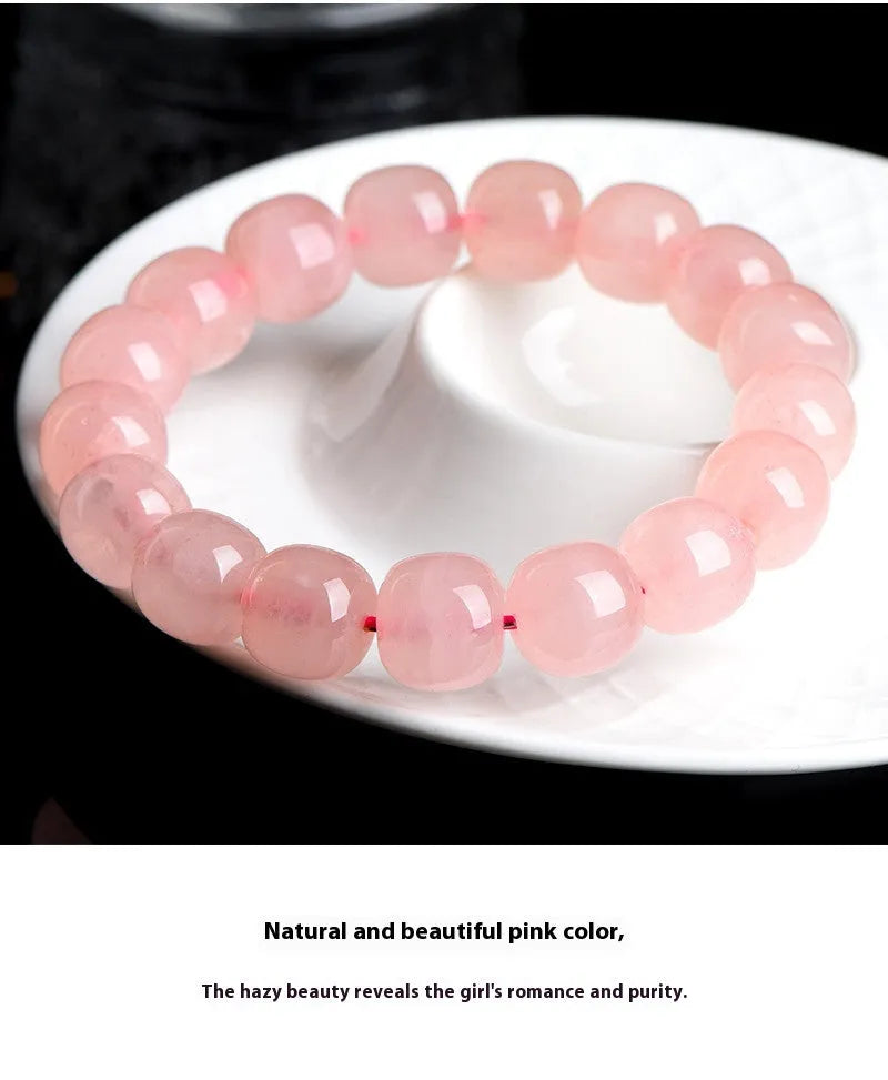 Natural pink crystal bead bracelet with geometric barrel-shaped design measuring 8-10mm per bead