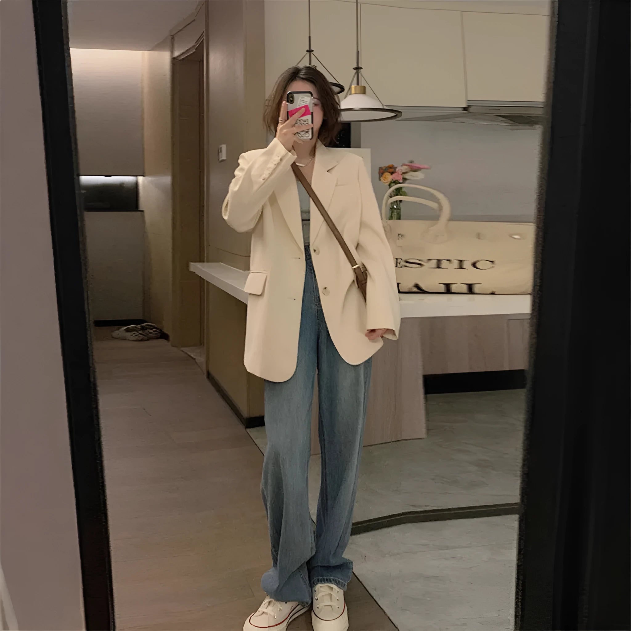 Korean style small suit jacket in polyester fabric, shown in milky white colour with long sleeves and pockets