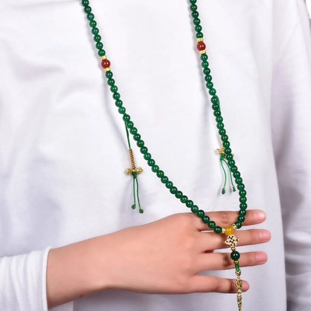 Handcrafted multi-circle green agate bracelet with natural stone beads on a wrist.
