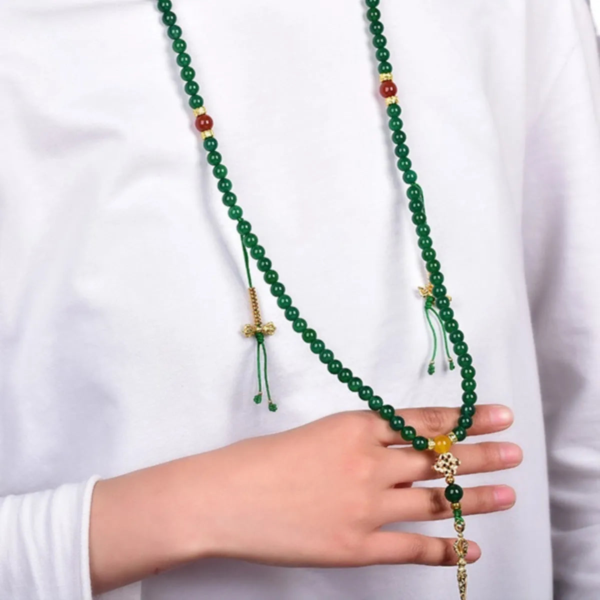 Handcrafted multi-circle green agate bracelet with natural stone beads on a wrist.