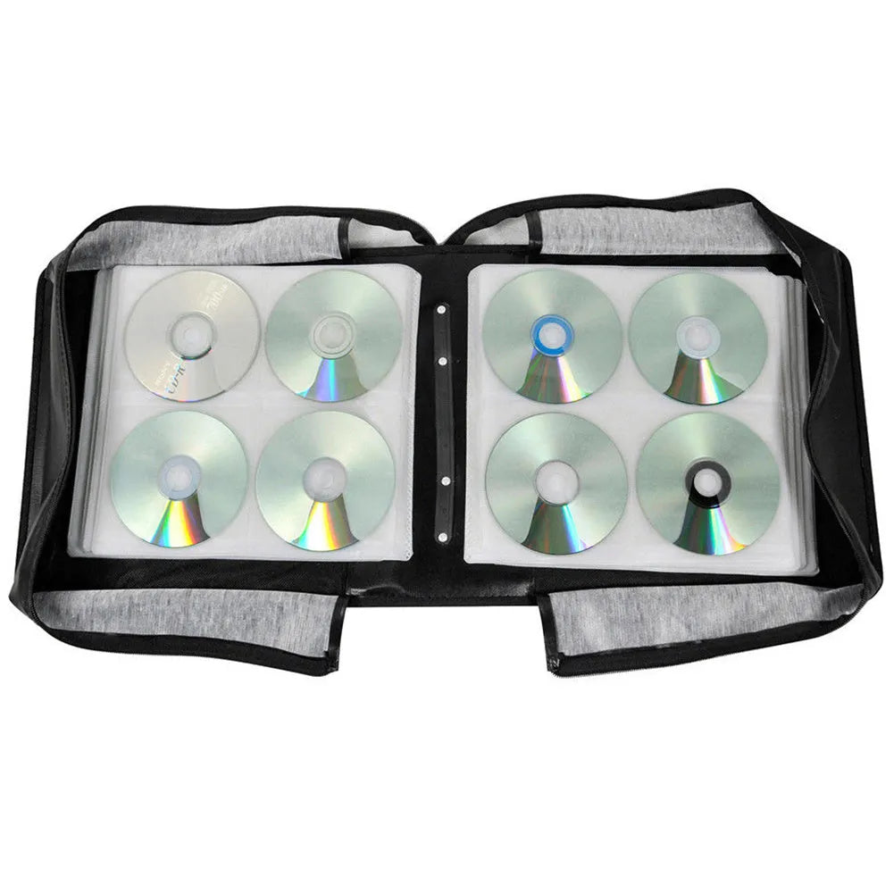 Black Oxford fabric CD storage binder case with a zipper and top hand strap.