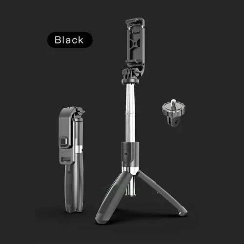 Black Bluetooth selfie stick extended to full length with smartphone attached and remote control in hand