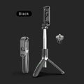 Black Bluetooth selfie stick extended to full length with smartphone attached and remote control in hand