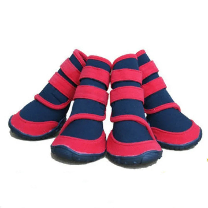 Waterproof pet shoes with wet suit fabric body, beef sole and multi-toothed non-slip tread in red or blue