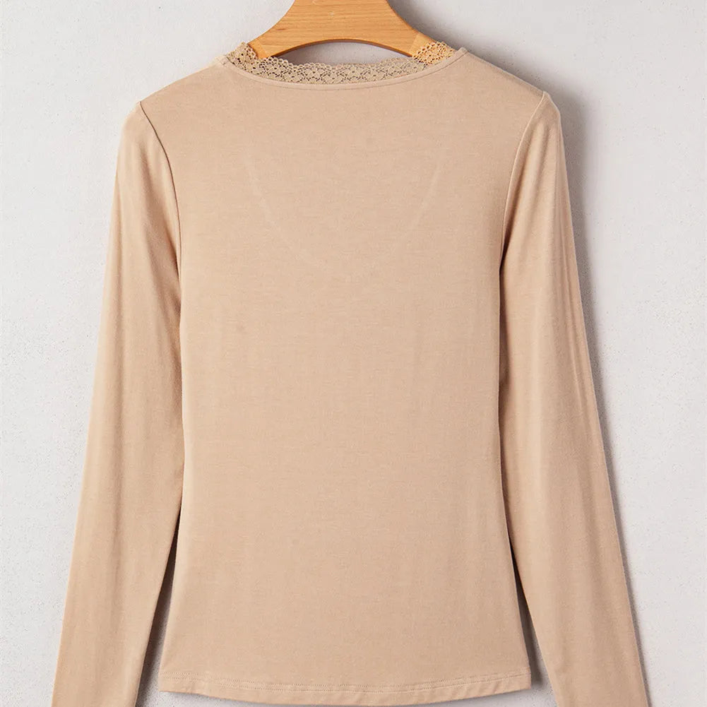 Red slim fit long sleeve casual top with lace trim on a hanger.