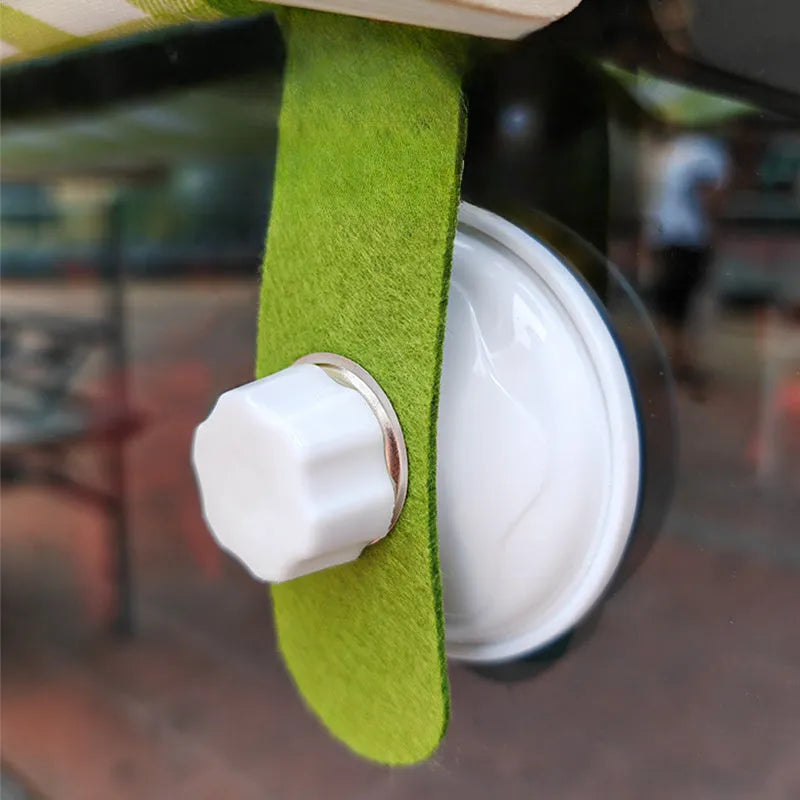 Wooden cat window hammock with linen fabric attached to window using suction cups
