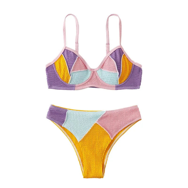 Women's colour block bikini set with halter neck top featuring steel underwire and matching shorts.
