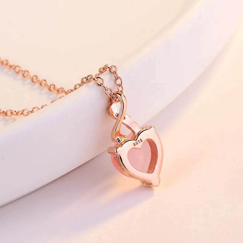 Women's heart-shaped pink crystal pendant necklace with rose gold cross chain