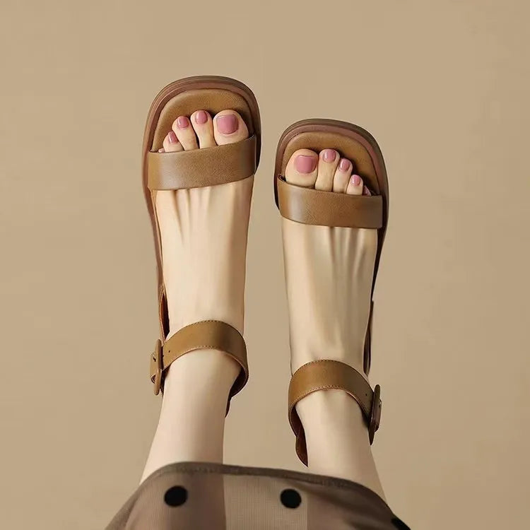 Women's white retro ankle-strap platform high heels with round toe and adjustable buckle.