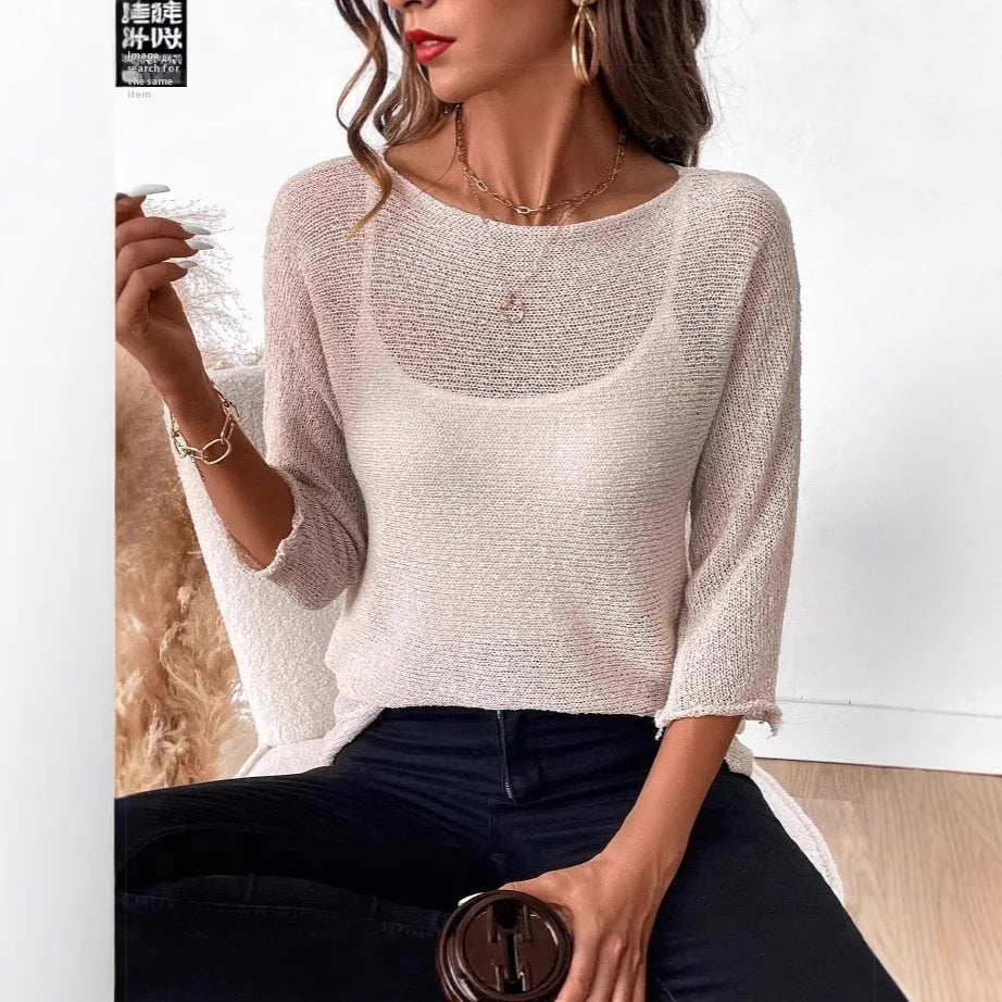Thin knitted off-shoulder top for women with 3/4 sleeves and a see-through 3D pattern in multiple colour options.