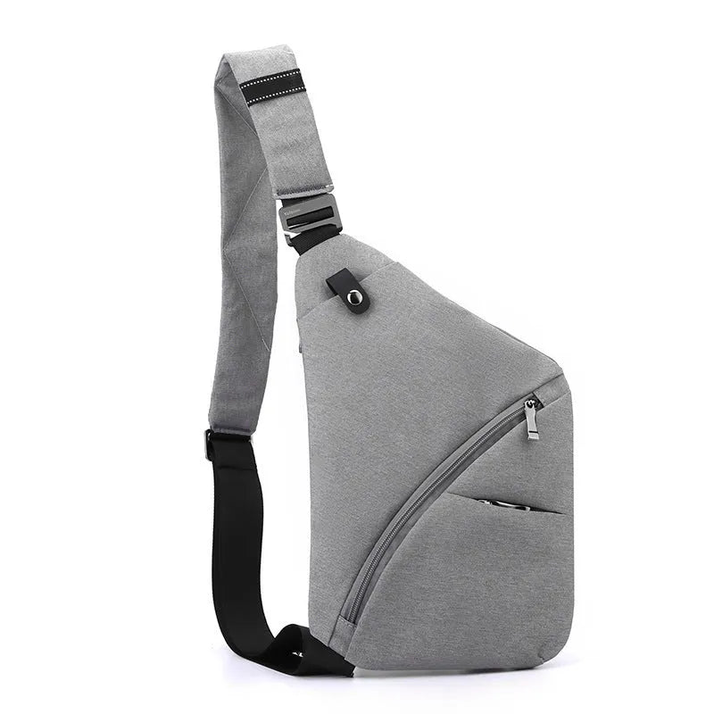 Grey men's oxford cloth chest bag with letter detail, worn on the shoulder.