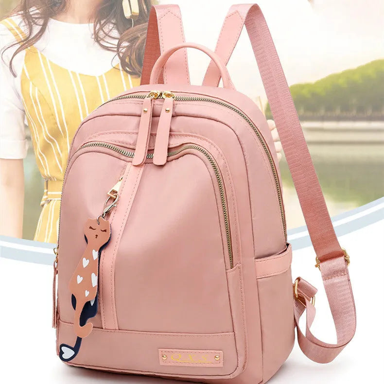 Women's black casual nylon backpack with multiple pockets and soft shoulder straps