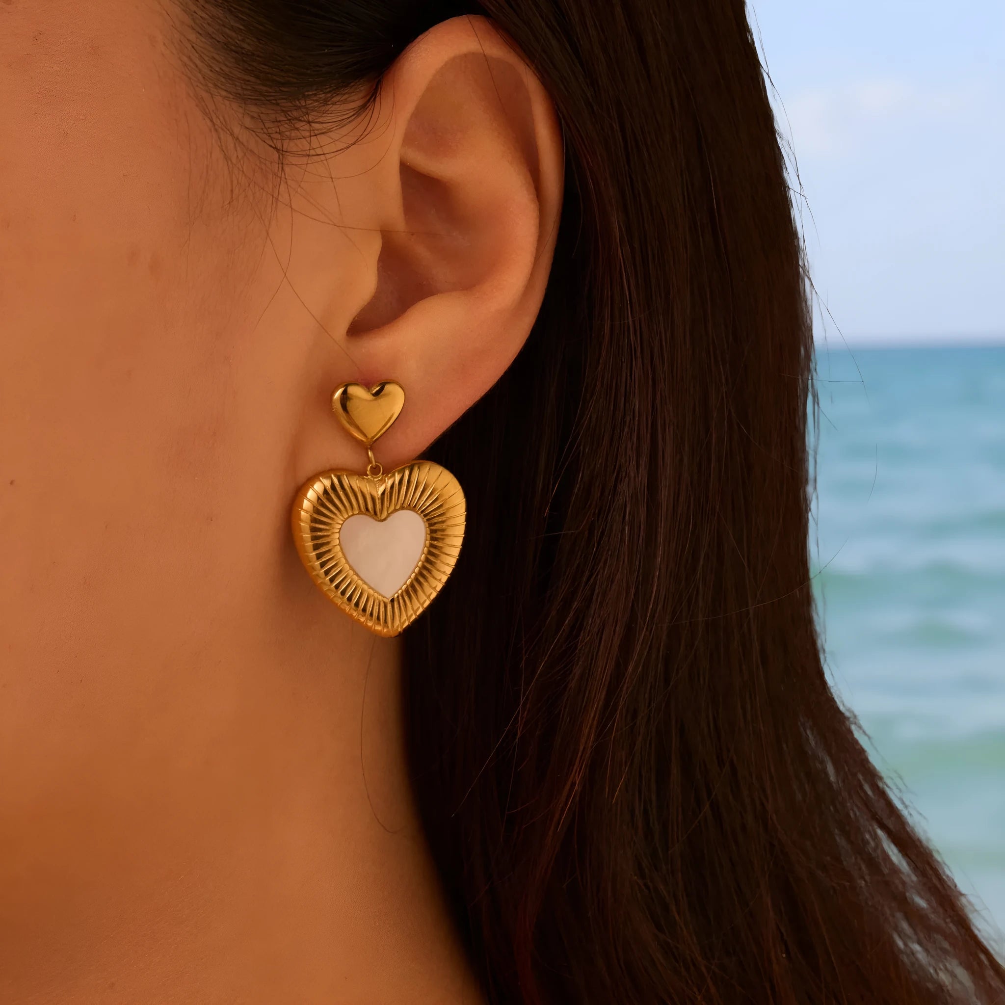 Gold electroplated heart-shaped stainless steel earrings with 18K purity and love element design