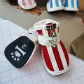 Set of four blue cloth dog shoes for small dogs with non-slip soles and a zip fastening.