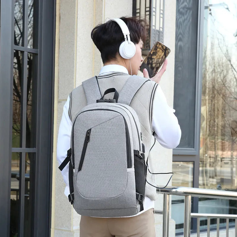 Men's Oxford cloth computer backpack in solid colour with street trend style.