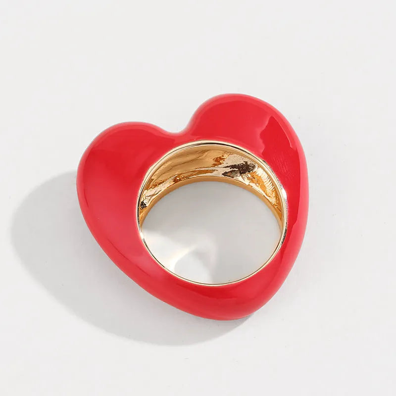 Three-dimensional heart-shaped enamel ring in a choice of colours on a zinc alloy band.