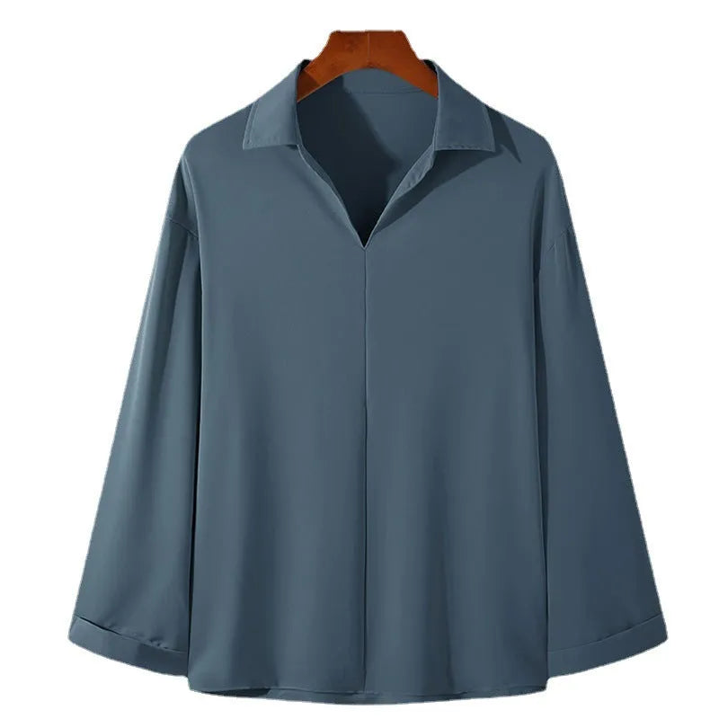Men's loose fit long sleeve casual shirt in solid colour on a hanger.