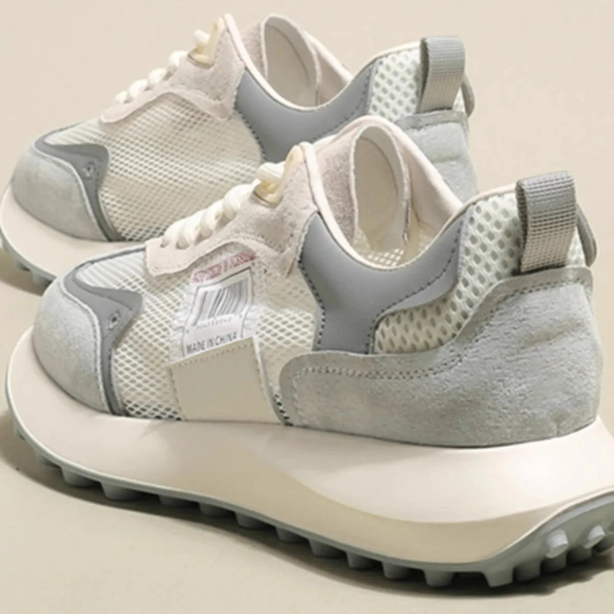 Women's grey and pink retro sneakers with low-top flat heel design and mesh lining