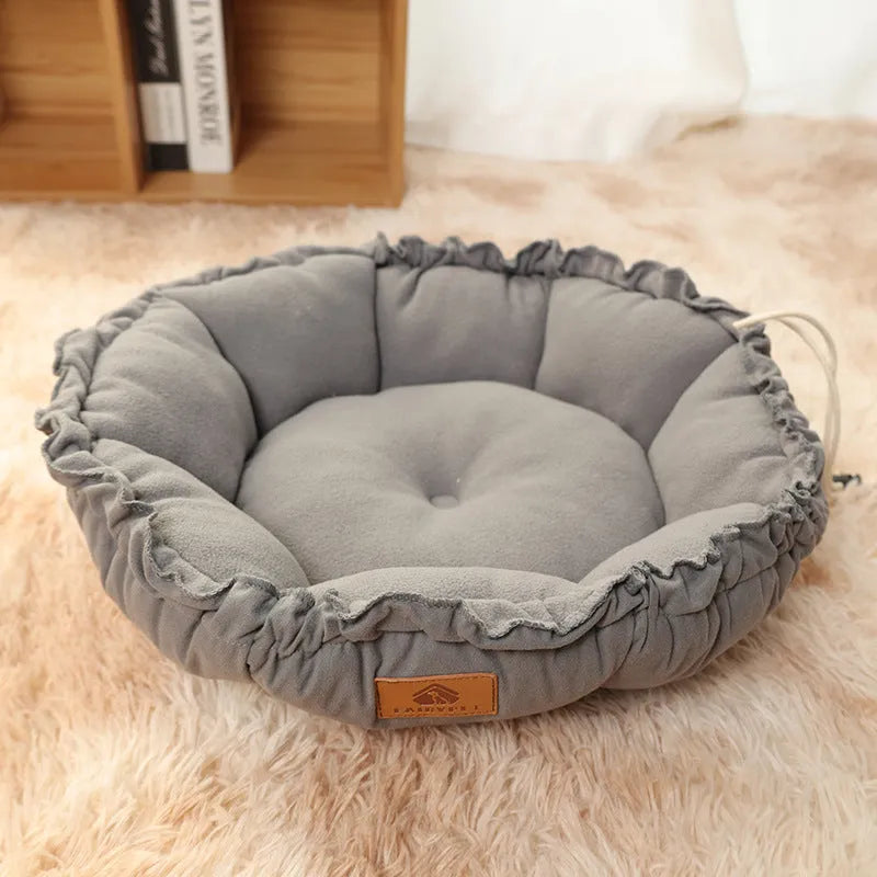 Grey reversible donut pet bed with raised bolsters for cats and small dogs