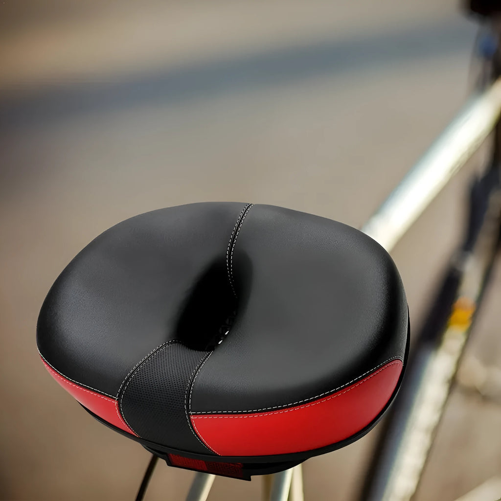 Large red bicycle saddle with shock absorber and PU stitching for mountain bikes