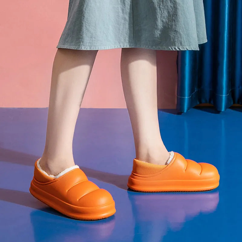 Women's waterproof EVA garden slippers in assorted colours with plush lining and non-slip soles.