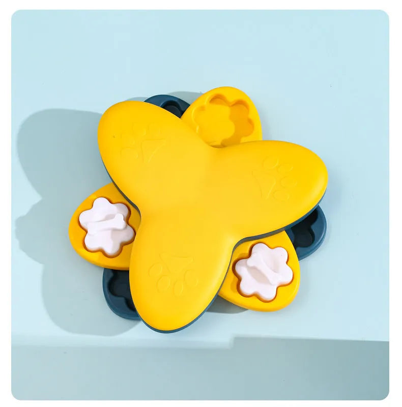 Green and yellow dog puzzle toy with bone-shaped covers and non-slip base.